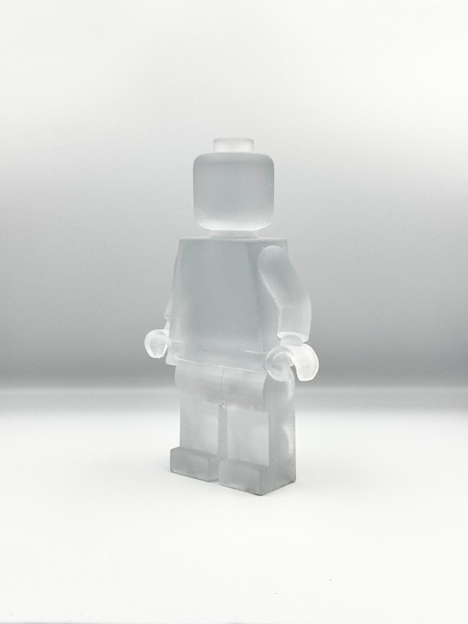 lego man sculpture in clear frosted finish