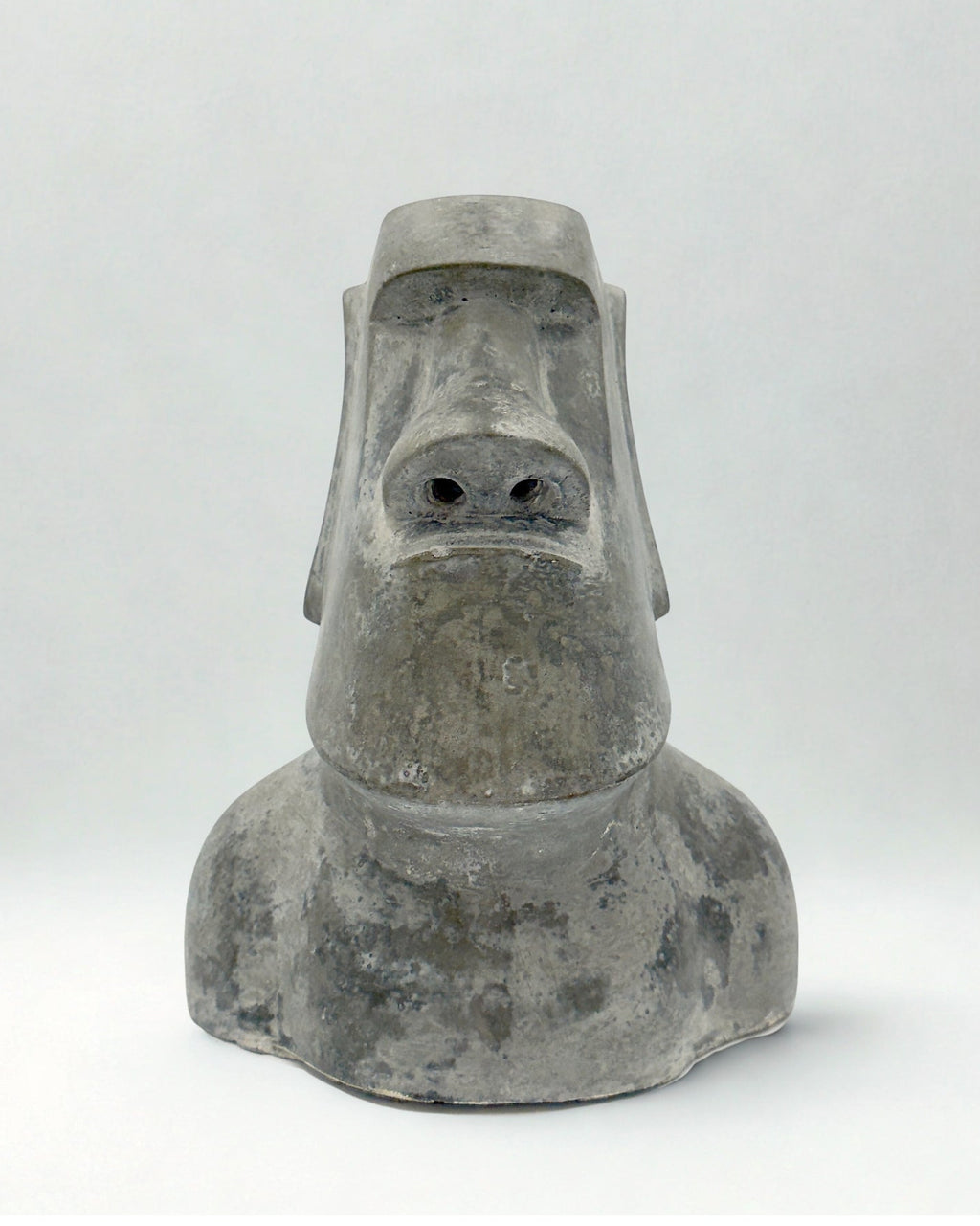 Concrete Moai sculpture on a white background
